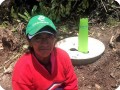 15. This Green Musketeer is proud of her just planted tree with the Waterboxx plant cocoon