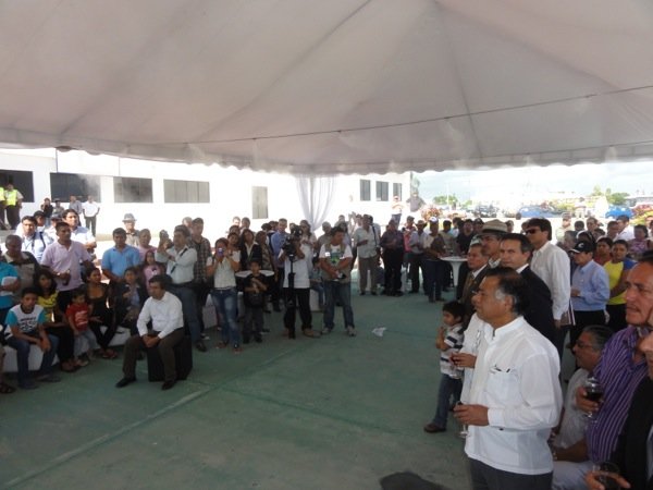 A toast and speeches are celebrated outside