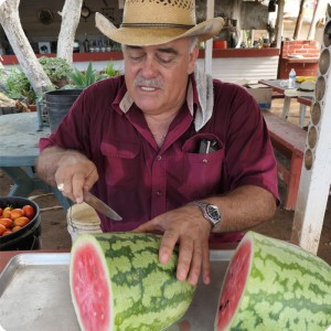 48 August 10   Mr. Gastellum prepares the first watermelon ever produced in a growboxx plant cocoon
