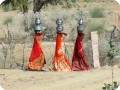 5 The women carry the water in stainless steel jars to their homes