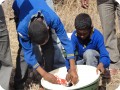 22 Two students of the Salem School are assembling a Groasis waterboxx