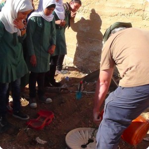 20161110   3 Michael Schuring  distributor of Groasis in Jordan  showing how to plant and put water according to Groasis Technology Instructions