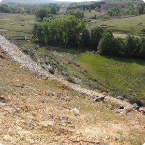 7 The dumped rocks are covered again with the original top layer which we reforest with the help of the Groasis waterboxx