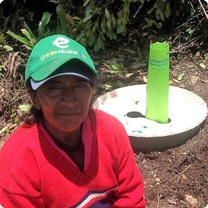 15. This Green Musketeer is proud of her just planted tree with the Waterboxx plant cocoon