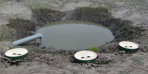 Capillary hang water (groundwater) in the soil, where the soil is dark - more water can be found