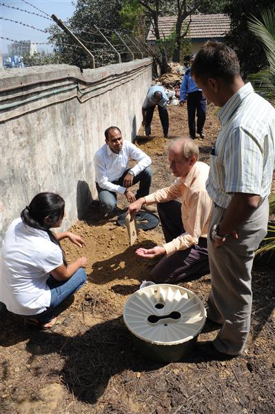 Pieter Hoff plants the first Groasis Waterboxx in India at INS Trata, Mumbai, 2010.